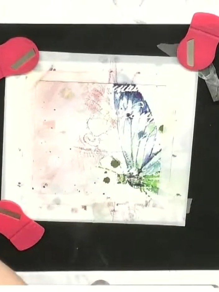 Step 5: Carefully remove the stencil to reveal the blended ink design with stamped butterfly detail. The nested frame 