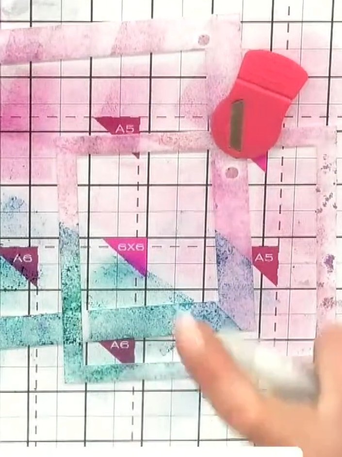 Step 2: Place your stencil on the glass mat and ink through it using one colour. Work on the glass mat for easy cleanu