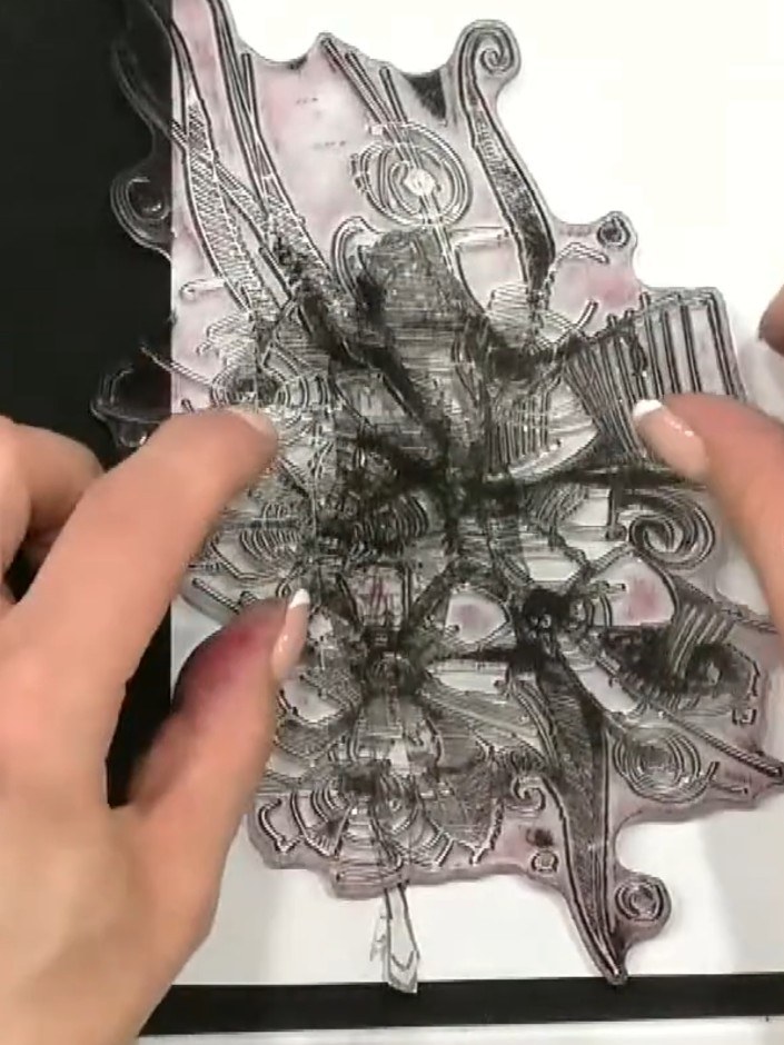 Step 2: Position the floral stamp over the masked doll image and stamp it using black ink to create a layered, overlap