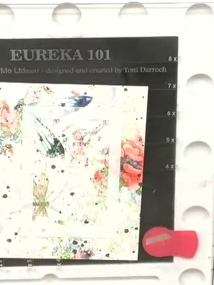 Step 1: Position a rectangle aperture stencil on your floral patterned card base. Secure it in place using glue dots o