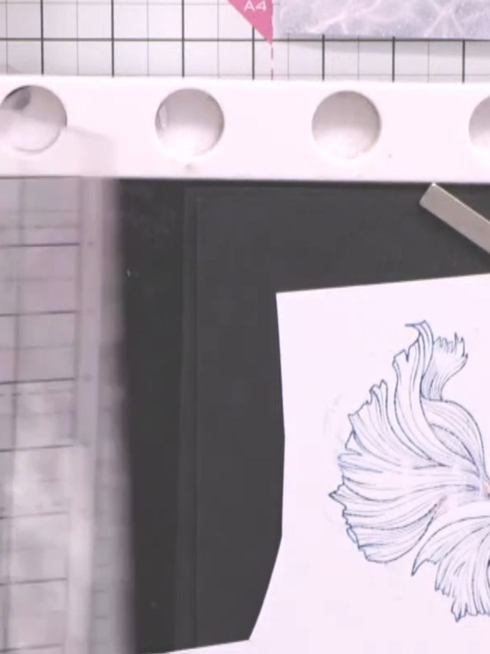 Step 7: Stamp the fish tail image again on a separate piece of white cardstock using purple and blue inks.