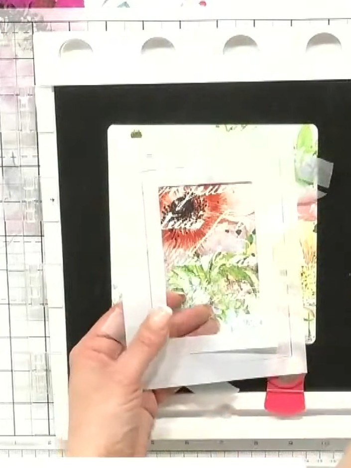 Step 1: Take three white aperture stencils and tape them together to create a thicker frame. Position the layered fram