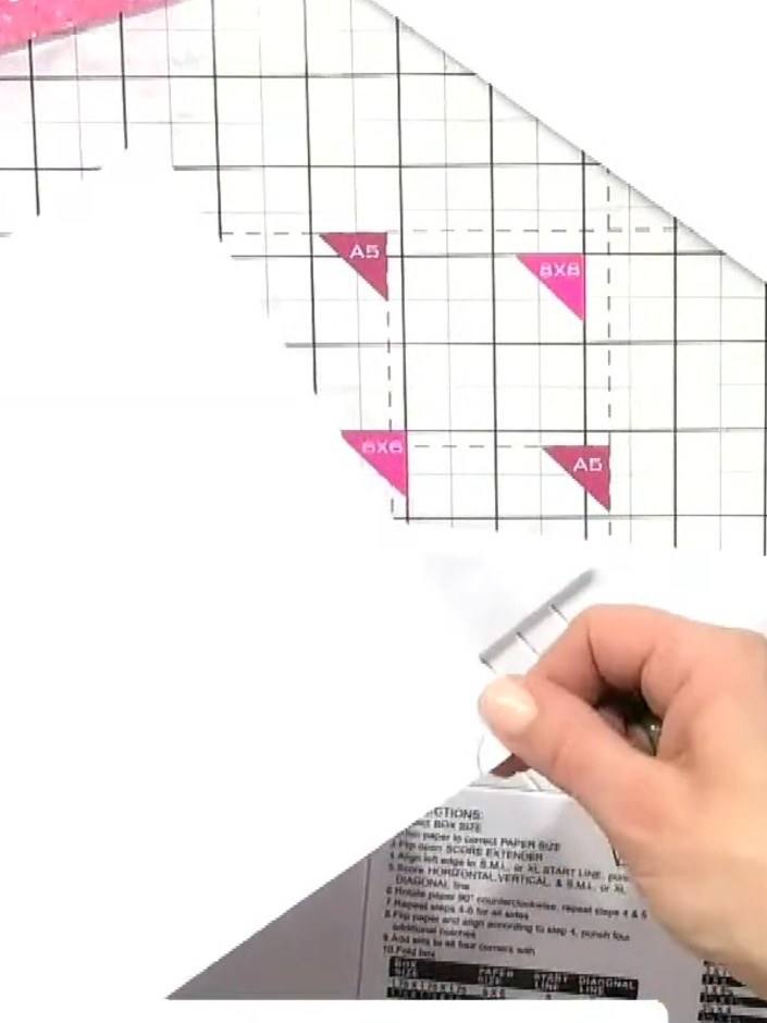 Step 1: Place your 12 by 12 inch paper on the scoring board. Locate the XL starting line marked on the board and align