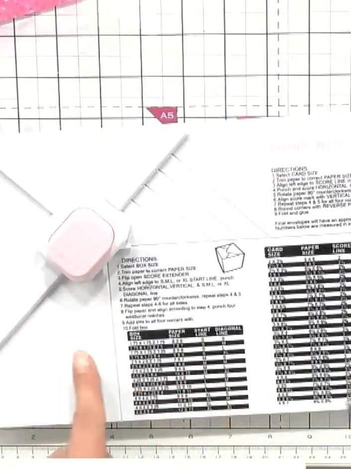 Step 2: Open the exaggeration bar on your scoring tool. Score your first line by placing the paper at the starting lin