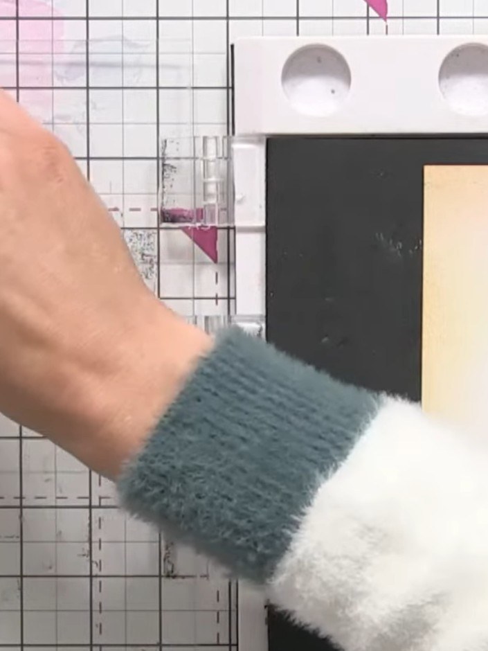 Step 5: Take your ink pad and apply purple ink to some areas of the stamp. Add green or teal ink to the leaf sections 