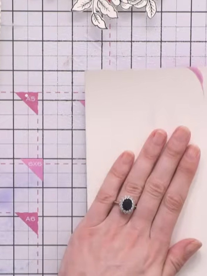 Step 8: Once the watercoloured piece is dry, flatten it by placing it under a die-cutting machine plate or heavy book 