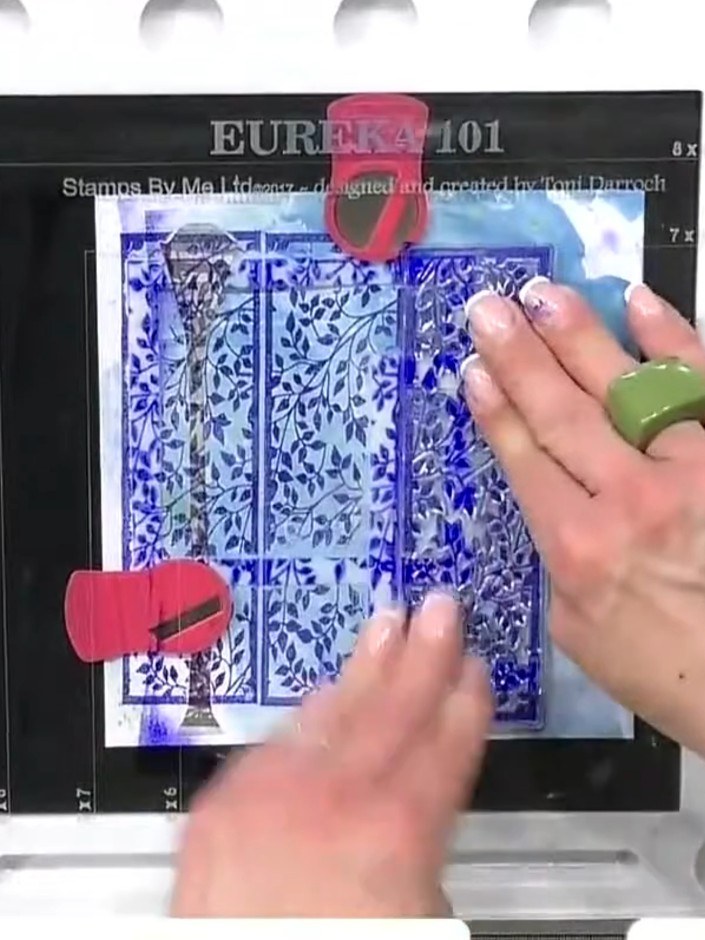 Step 5: Stamp the City Lights London stamp over the top of your composition using embossing ink. Apply the ink evenly 