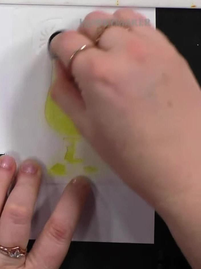 Step 1: Position your first layering stencil (numbered 1) onto white cardstock. Using a yellow ink pad from the Tequil