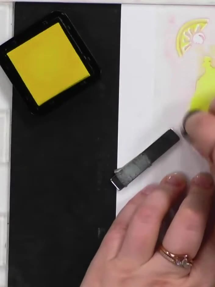 Step 2: Line up the second layering stencil (numbered 2) using the heart registration marks and apply yellow ink again