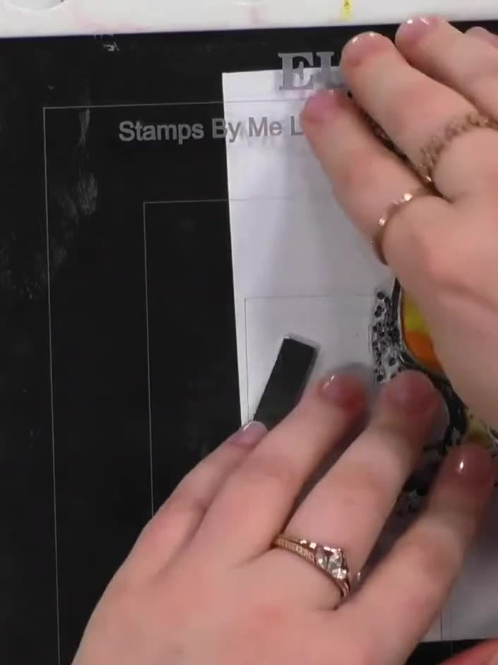 Step 5: Place your stamped and coloured Tequila Sunrise image into the embossing folder, carefully aligning it with th