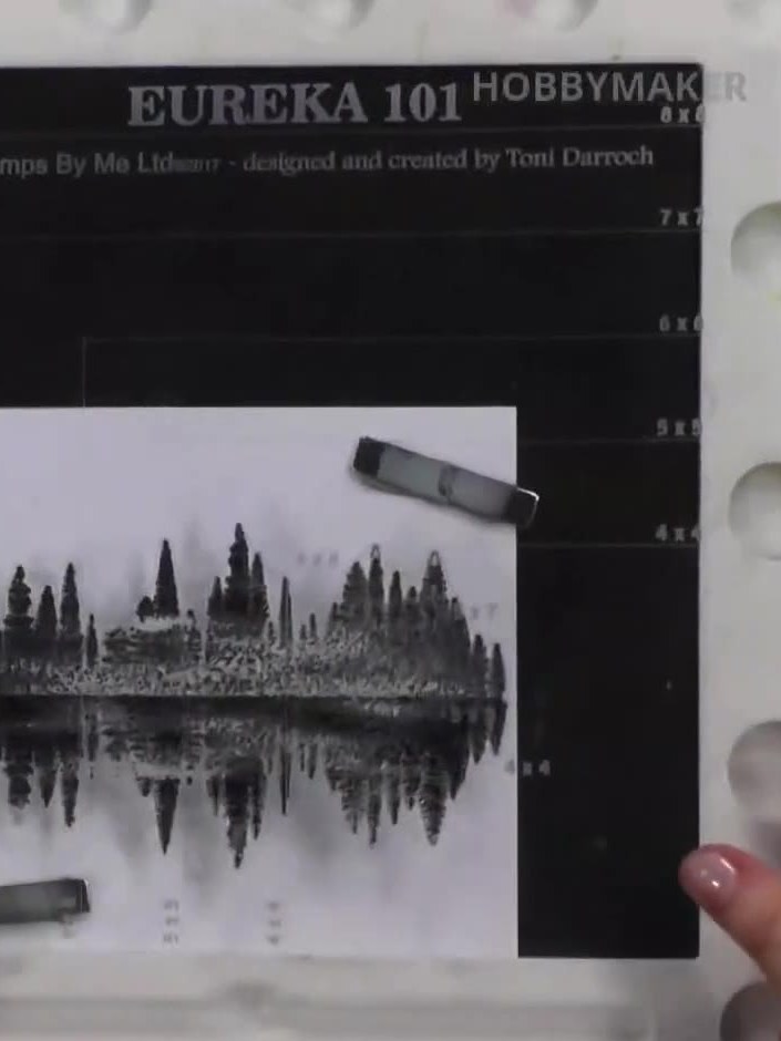 Step 2: Stamp the same forest reflection image again, this time only stamping the top portion of the image. Press hard