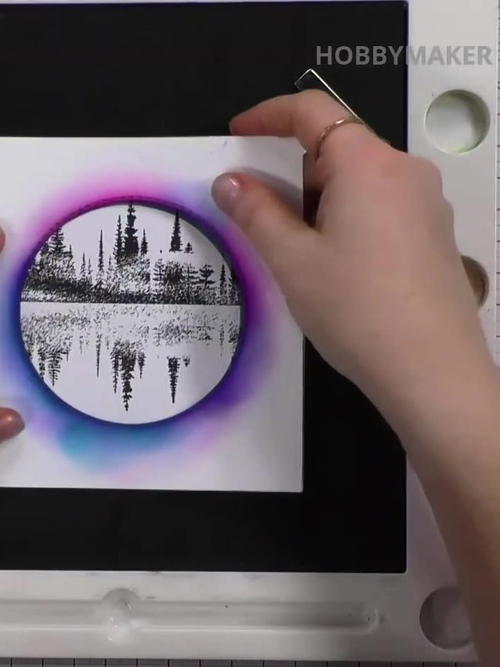 Step 7: Add purple ink to the moon area to create additional depth and dimension. Blend the purple ink around the edge