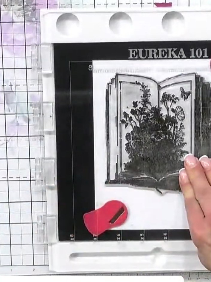 Step 1: Stamp the Storyteller book image onto white decorative paper using black ink. Tap the stamp at least four time