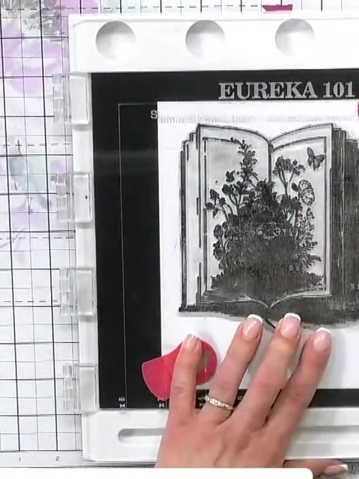 Step 2: Colour around the edges of the stamped book image using black ink to add depth and definition. Work the ink ar