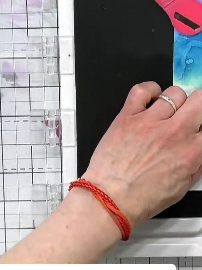 Step 2: Cut a mask from adhesive paper or masking tape. Position the mask over your watercolour background, leaving sp