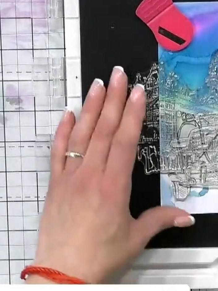 Step 5: Carefully remove the mask from the stamped cityscape. Reposition the mask to protect the cityscape area whilst