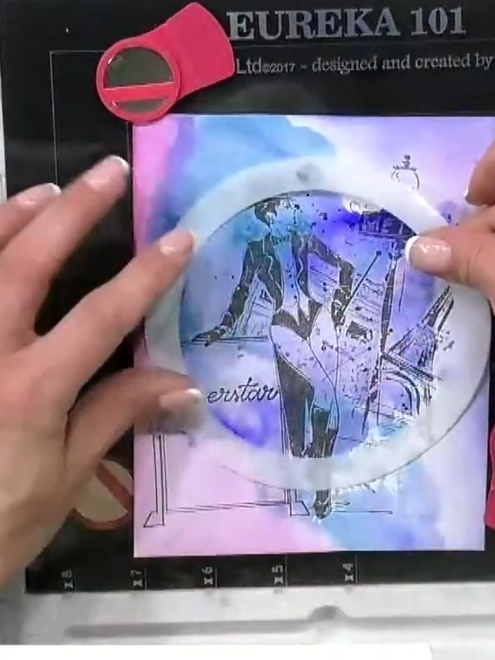 Step 5: Position an Imala stencil over the wet watercolour background and secure it with glue dots to prevent shifting
