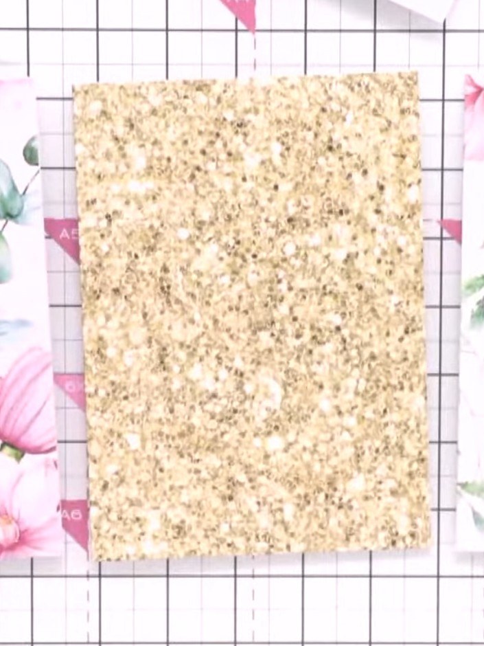Step 1: Select a card blank from the Magnolia collection. Choose a coordinating topper design from the selection provi