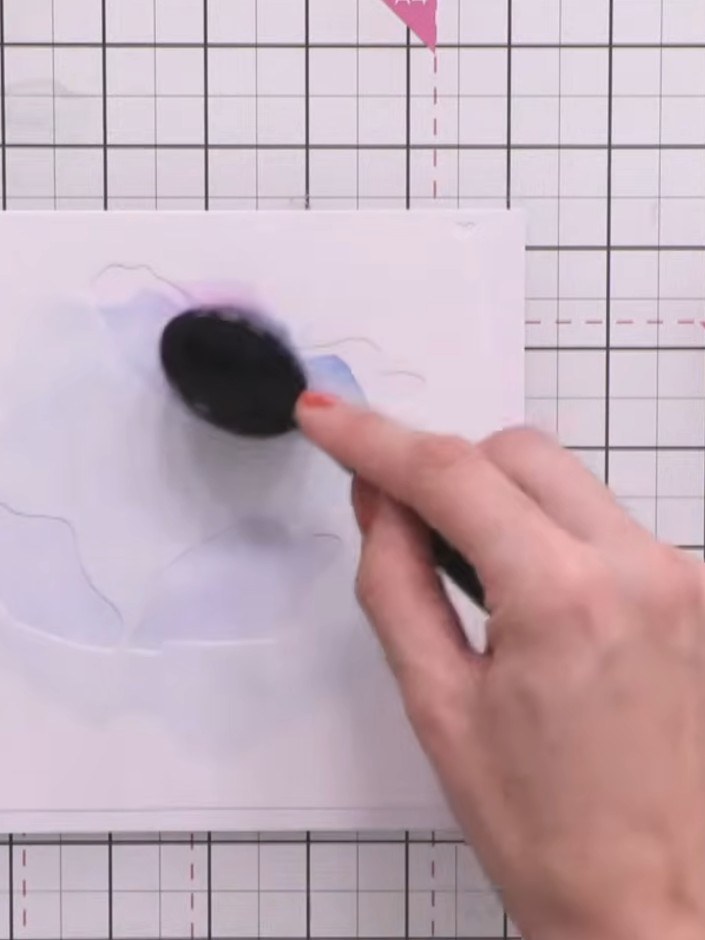 Step 3: Position stencil number two, lining it up with the edge, top and side of the card. Apply purple ink through th
