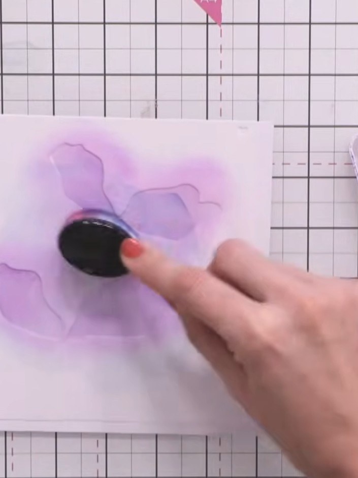 Step 4: Continue applying stencils three, four and five in sequence using purple ink. Change the shade of purple with 