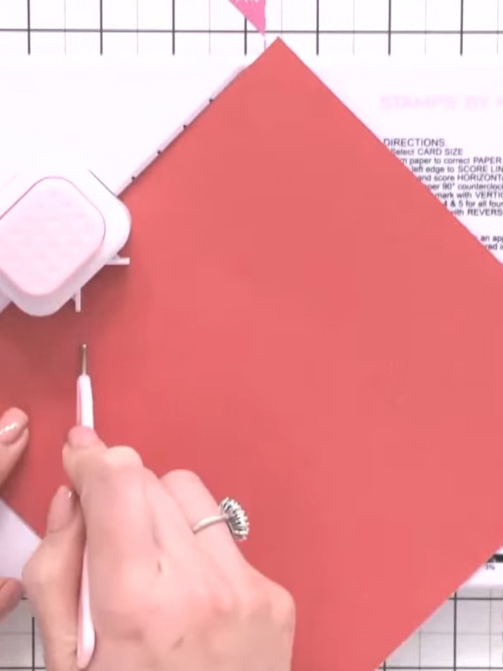 Step 1: Cut a piece of coral pink paper to 7¼ × 7¼ inches (or your chosen envelope size from the chart). Use the scori