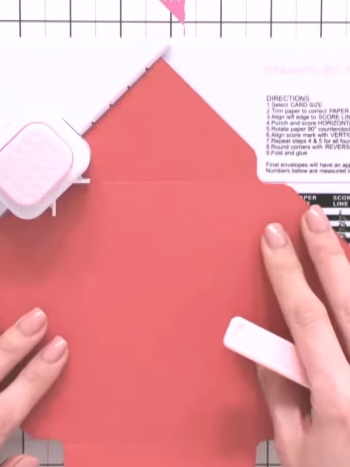 Step 6: Score the coral paper at the new position, turn it around, and punch out the corner using the corner punch wit