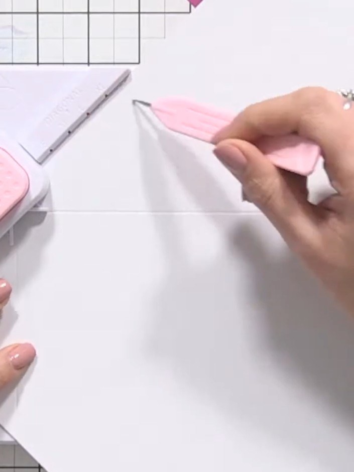 Step 5: Rotate the card 90 degrees and repeat the scoring process. Continue rotating and scoring at the XL diagonal li