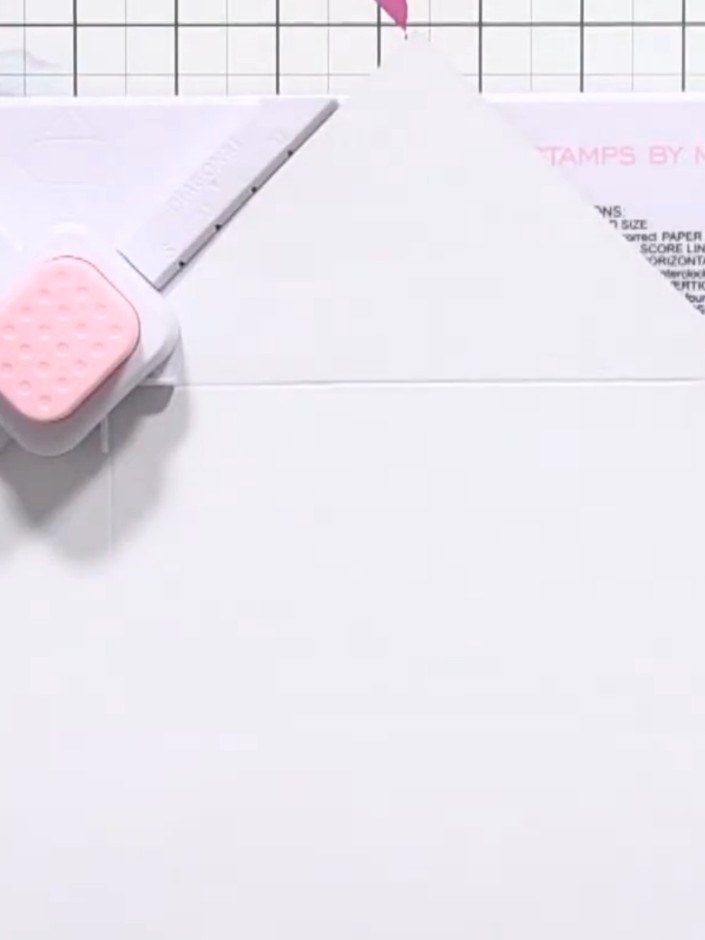 Step 1: Cut an 11 x 11 inch (28 x 28 cm) square of paper in your chosen colour or pattern using your trimmer or scorin