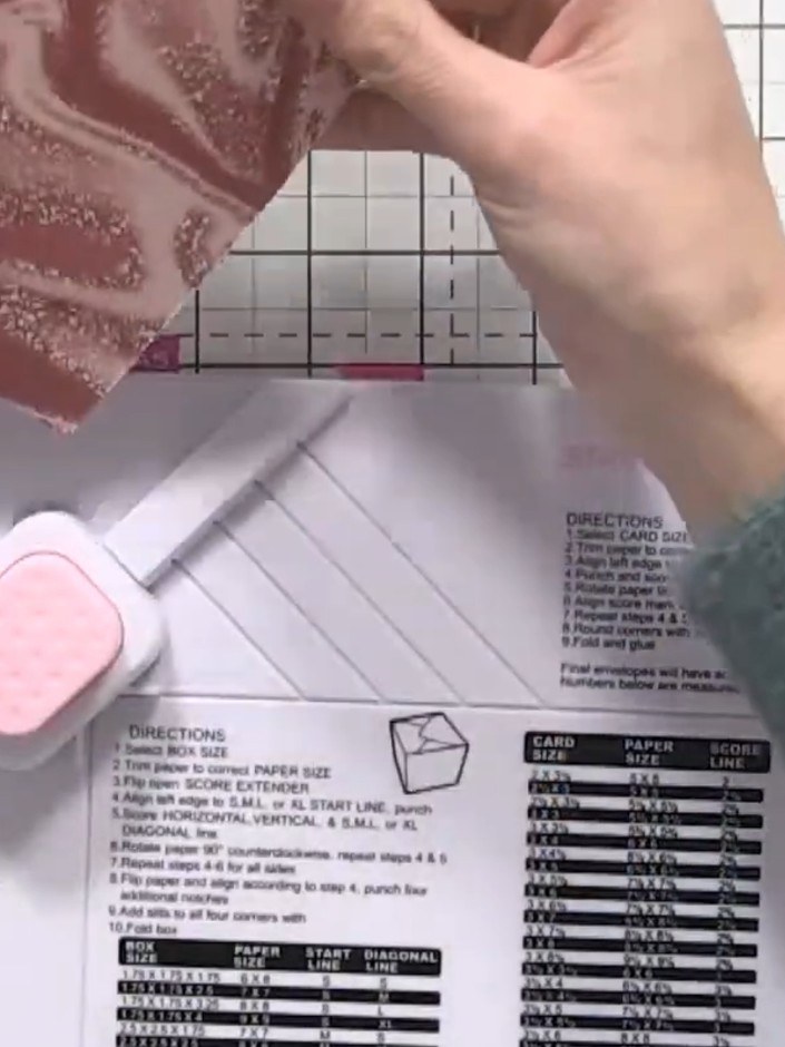Step 10: Fold the envelope together along the score lines, bringing all flaps inward to form the envelope shape. Secure