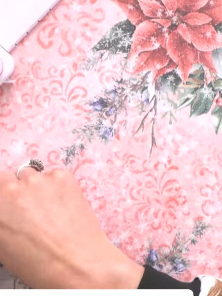 Step 3: Use the scoring tool to punch at the marked position on the decorative paper. This creates the first reference