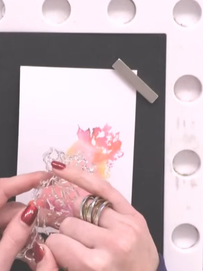 Step 6: Once the lamination is dry, ink up the second detailed lamination stamp with black ink, ensuring all the fine 
