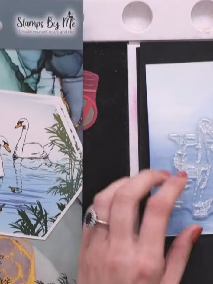 Step 4: Position the swan stamp from the Tomorrow collection on the upper portion of your prepared background card. St