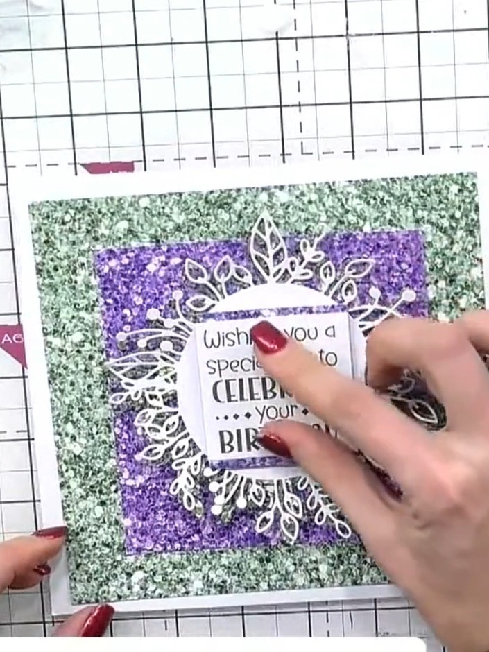 Step 9: Add cut-out flower and animal embellishments around the wreath design using foam pads for dimension. Position 