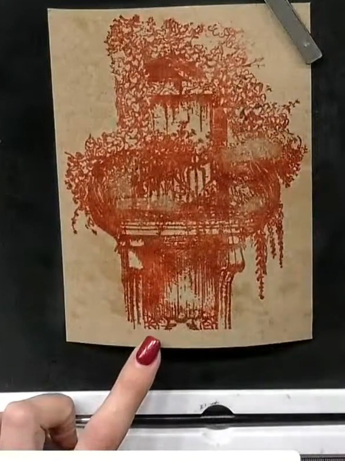 Step 10: Mount the finished stamped panel onto a black card blank using adhesive. Position it centrally to create a nea