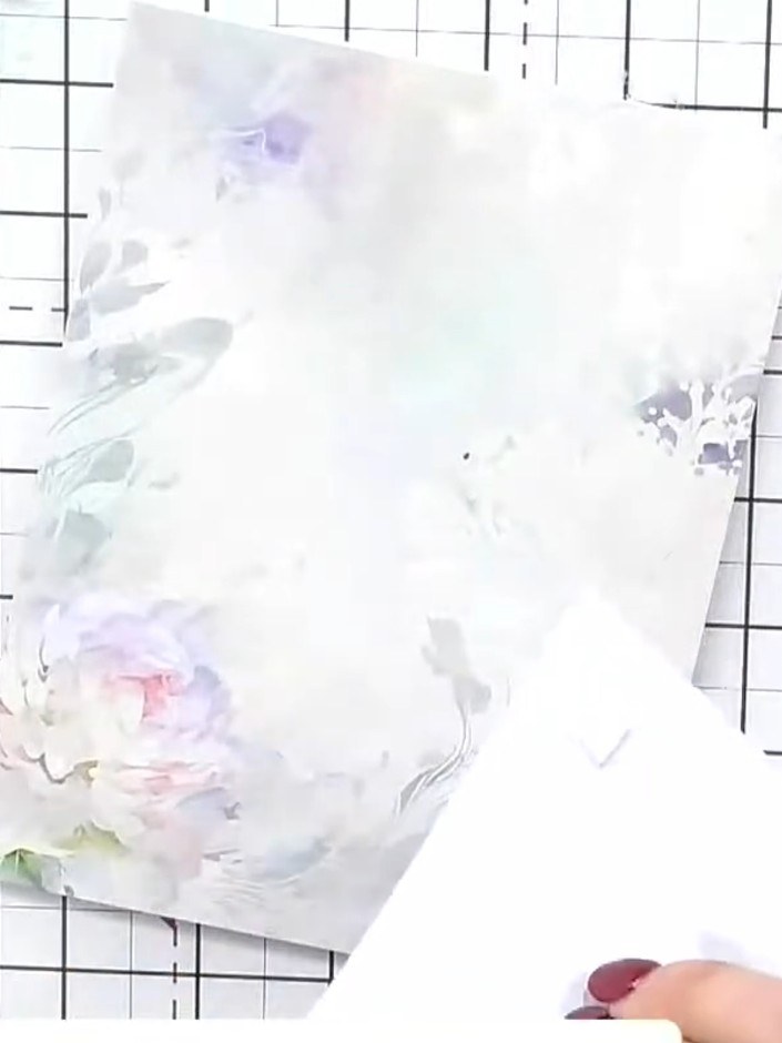 Step 2: Select a coordinating topper element from the kit. Choose one that complements the floral design you'll be cre