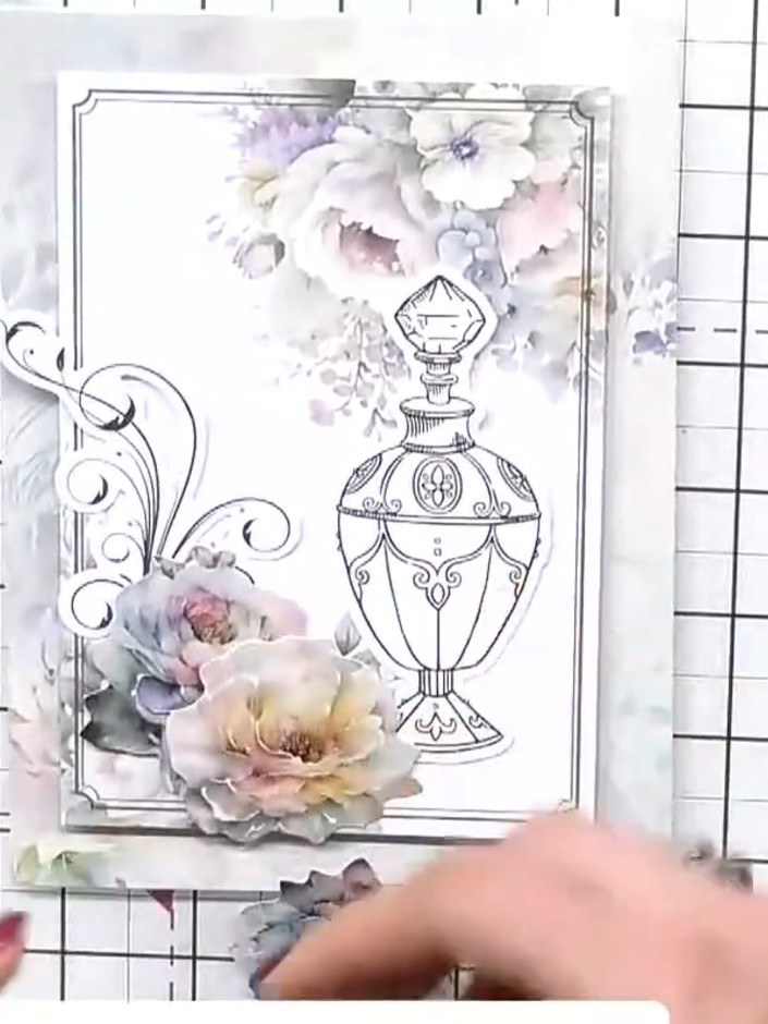 Step 7: Position and stick the padded flowers onto the card. Add decorative flourishes to the left side and bottom of 
