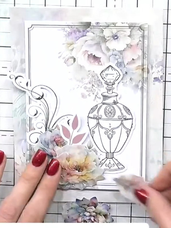 Step 9: Trim the stamped tag if needed and tuck it behind the flower arrangement on the card, positioning it amongst t