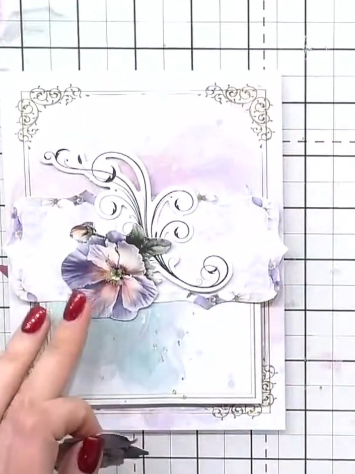 Step 12: Apply a rub-on design to the coordinating envelope. Burnish the design in place using a burnishing tool or you