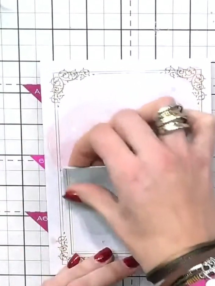 Step 6: Apply foam pads to the back of your decorative border elements. Position these pieces around the central frame