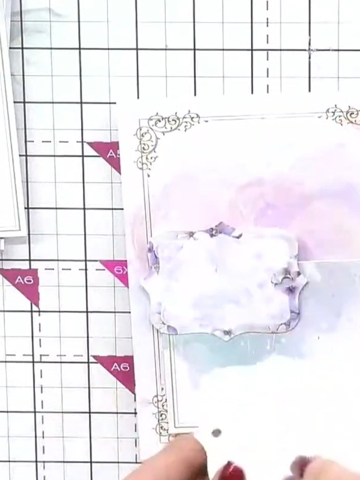 Step 8: Layer the floral embellishments in the centre of the card to hide any construction lines and create a focal po