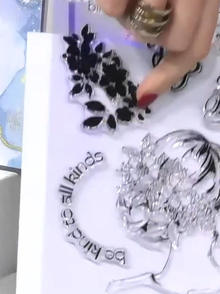 Step 1: Stamp the large hair design from the stamp set onto white 'All Surfaces' paper using black ink. Position the s