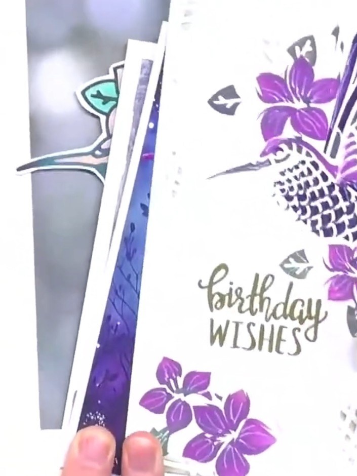 Step 4: Use the twist-and-turn die technology to cut two hummingbird elements. Twist the two pieces together to create
