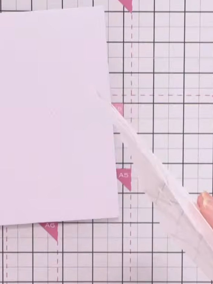 Step 2: Position stencil number one in the top corner of your white card blank, aligning it with the edge of the card 