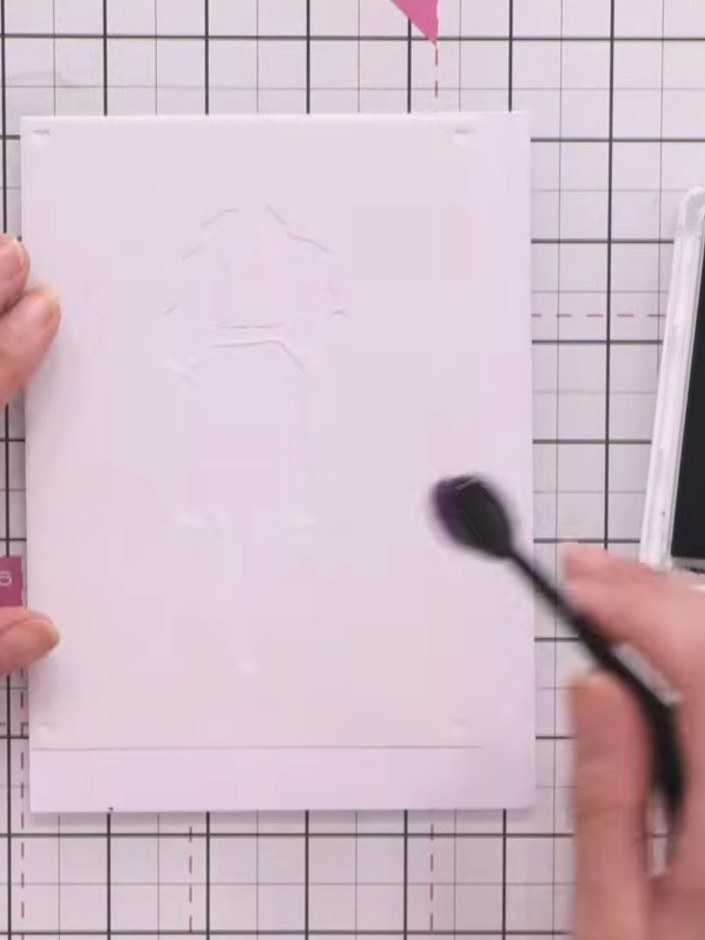 Step 3: Apply a light shade of teal ink through the first stencil using a blending brush, pressing gently onto the whi