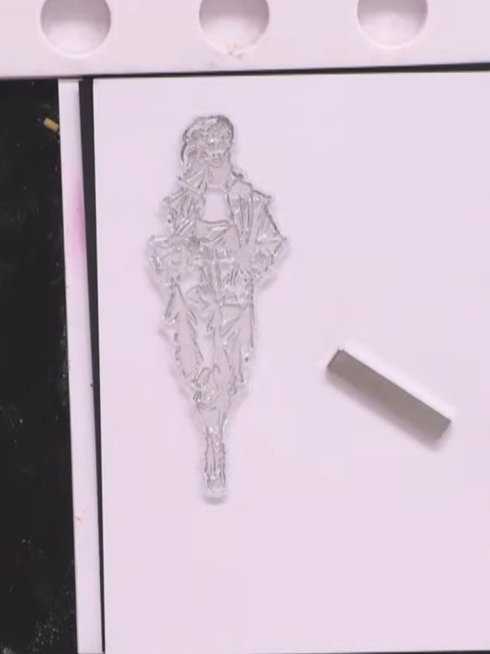 Step 7: Stamp the Stella lady figure again using black ink onto white patterned paper from the Couture Crosswalks coll