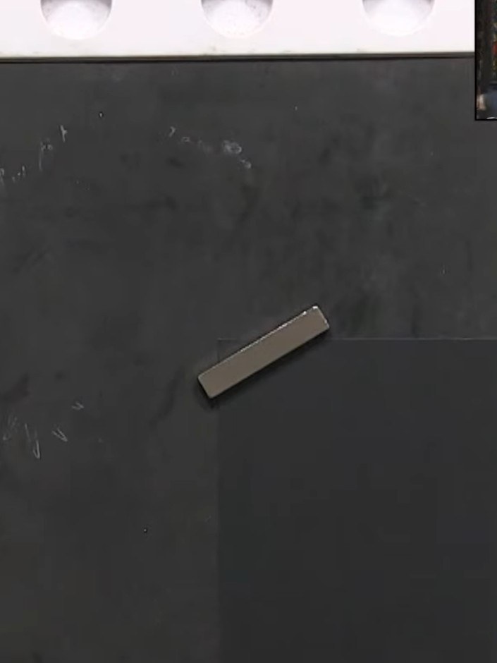 Step 3: Clean the stamp with a stamp cleaner. Position the black card in the same corner of your work surface, holding