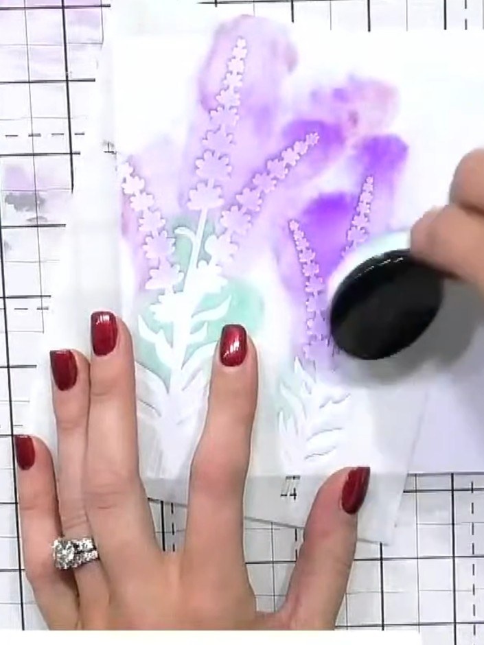 Step 5: Apply more purple ink through the top portion of the stencil using a blending tool, building up the colour and