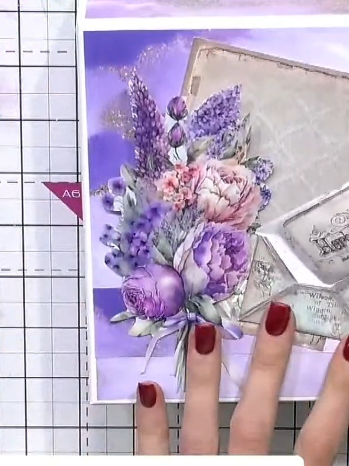 Step 6: Glue the ephemera toppers and fussy-cut floral elements onto the box lid, building up layers to create dimensi
