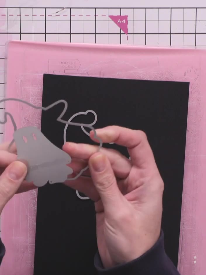 Step 2: Score a line down the centre of one piece of black cardstock using a score tool or scoreboard.