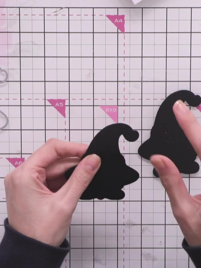 Step 3: Fold the scored piece forward and back to create a hinge. This will allow the gnome shape to stand freely.
